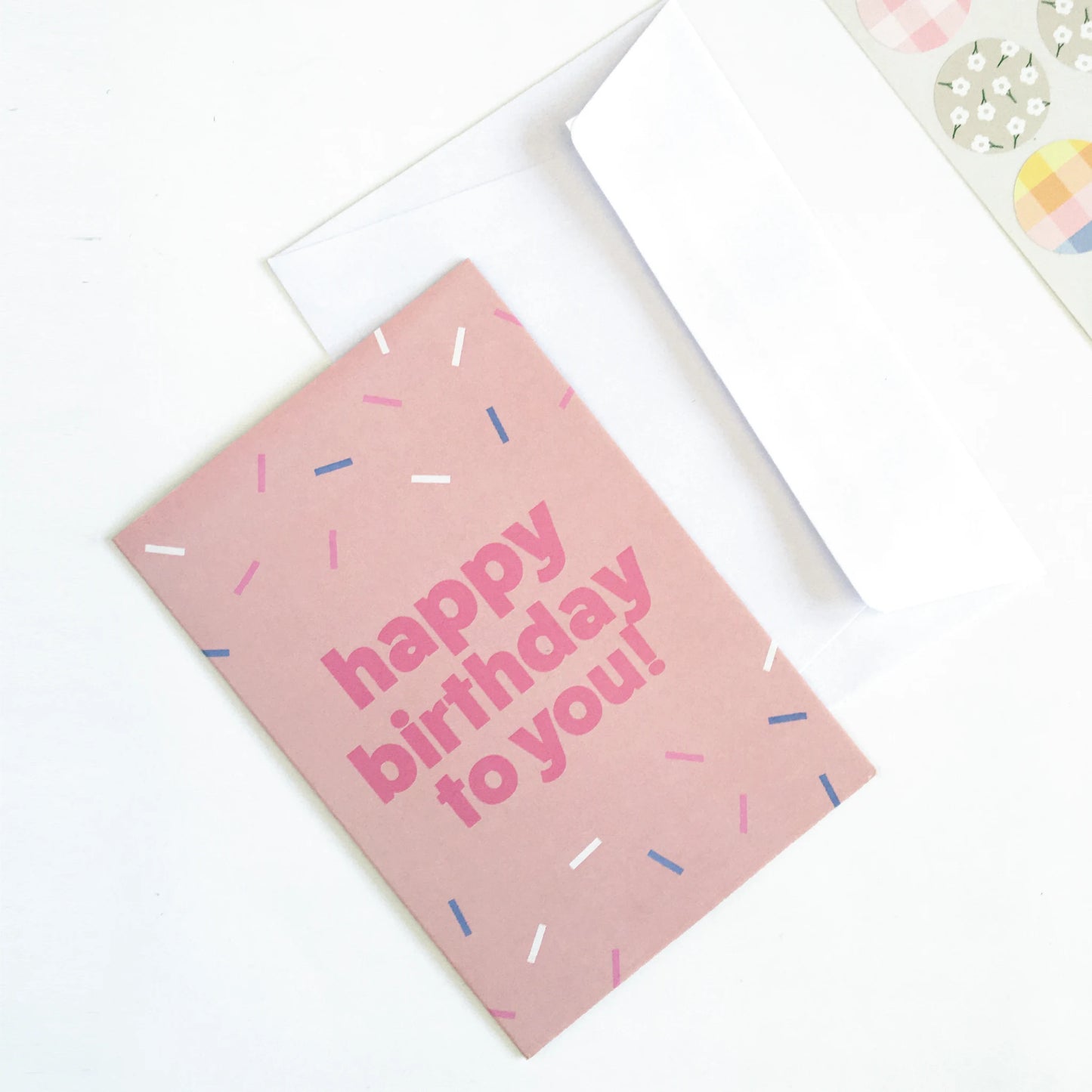 Fun & sprinkled, pink birthday card with white envelope